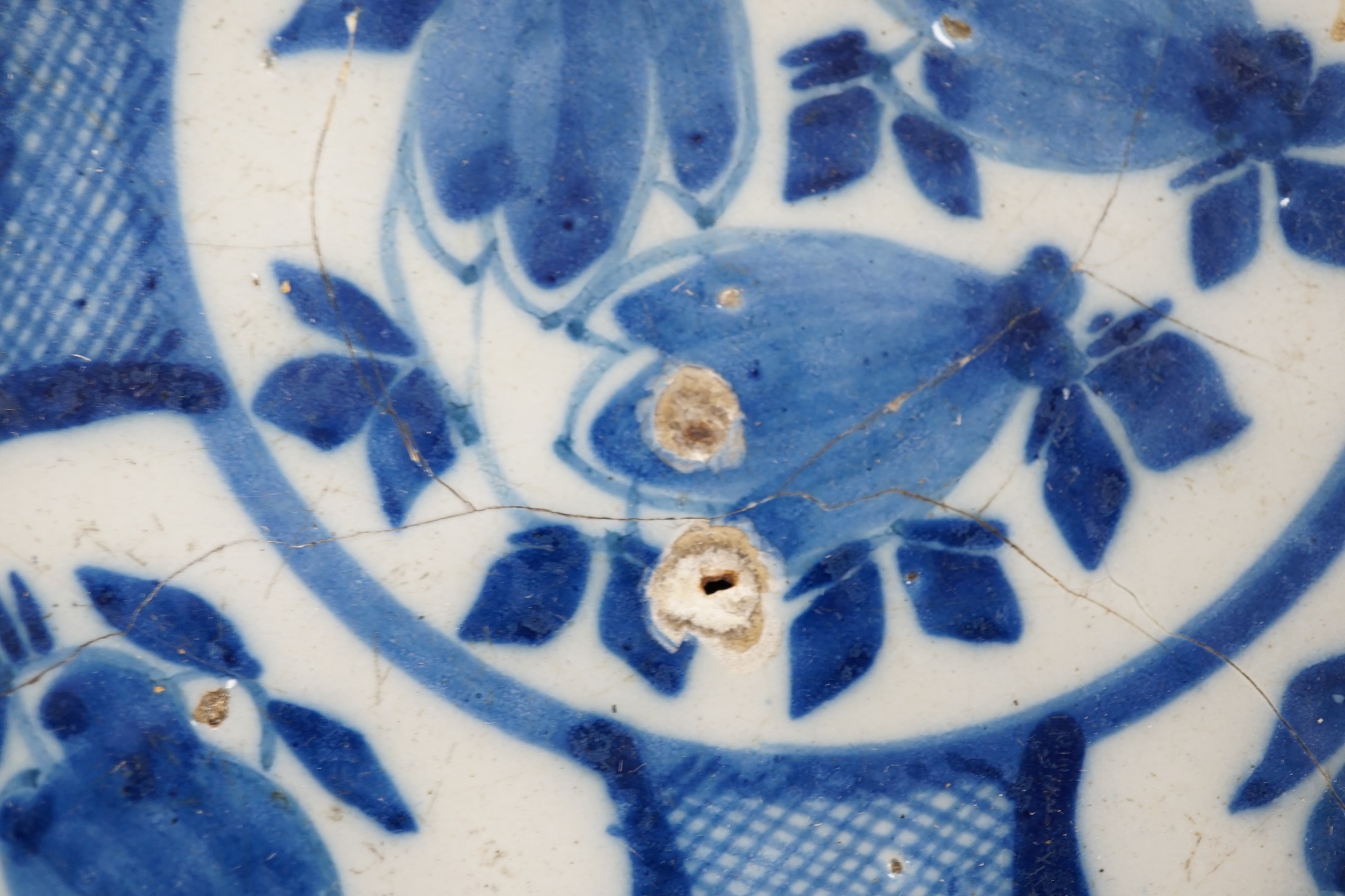 Four various continental delftware dishes, 18th and 19th century, largest 31cm diameter. Condition - various cracks and chipping to edges